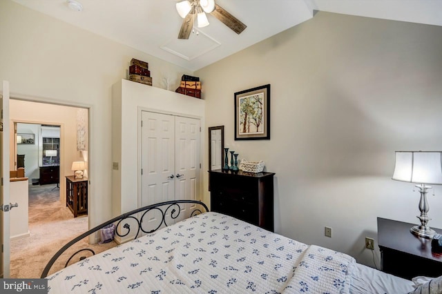 bedroom with vaulted ceiling, carpet, a closet, and ceiling fan