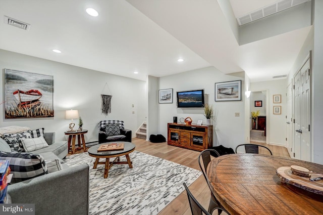 living room featuring hardwood / wood-style floors and a baseboard radiator