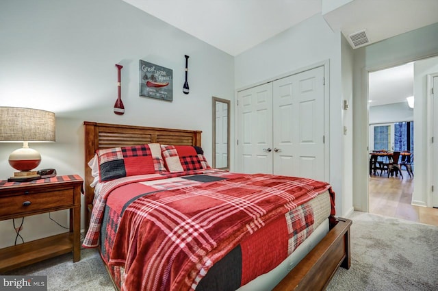 carpeted bedroom featuring a closet