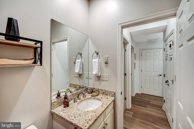 bathroom featuring hardwood / wood-style floors and vanity