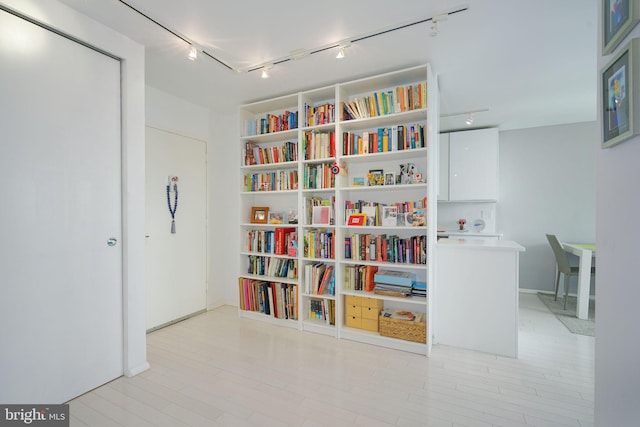 sitting room with light hardwood / wood-style flooring and rail lighting