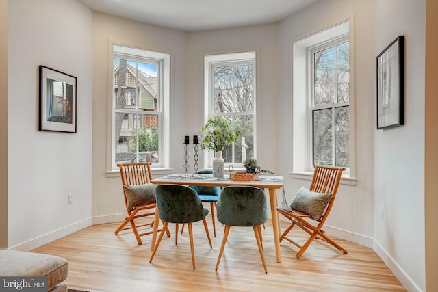 dining area with light wood-type flooring