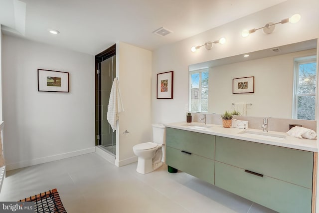 bathroom with toilet, dual bowl vanity, tile floors, and a shower with door