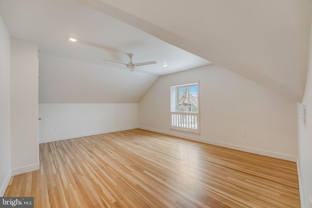 additional living space featuring light hardwood / wood-style flooring, ceiling fan, and vaulted ceiling