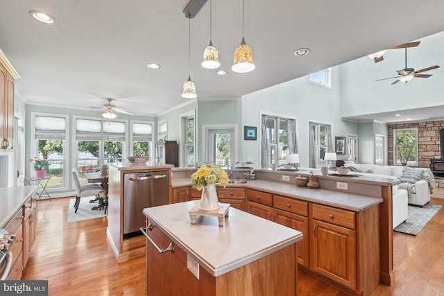 kitchen with a wealth of natural light, hanging light fixtures, and a center island