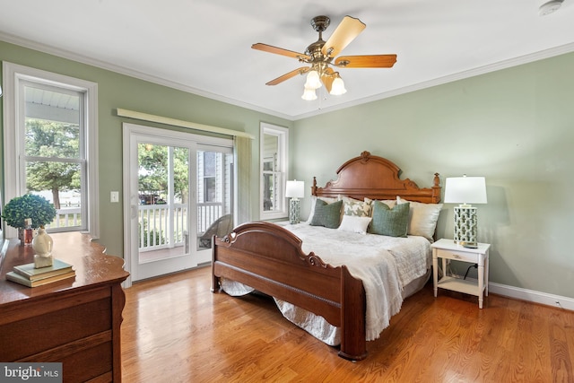 bedroom featuring ornamental molding, access to exterior, ceiling fan, and hardwood / wood-style floors