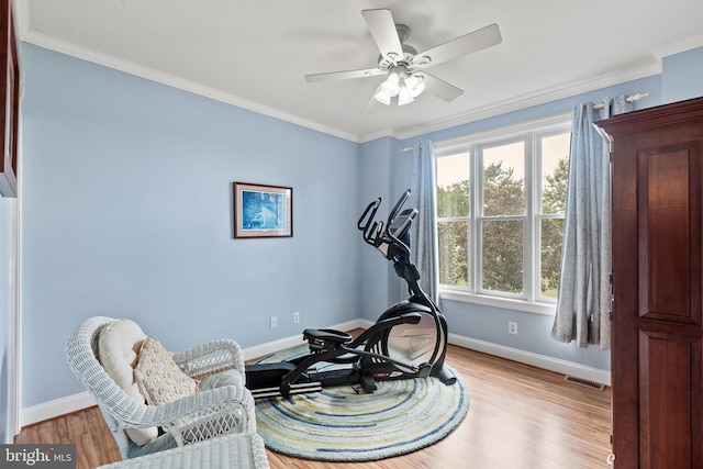 sitting room with ceiling fan, light hardwood / wood-style flooring, and ornamental molding