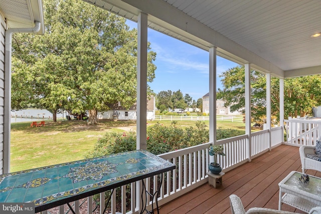 wooden deck with a yard