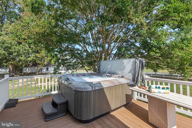 wooden terrace with a hot tub