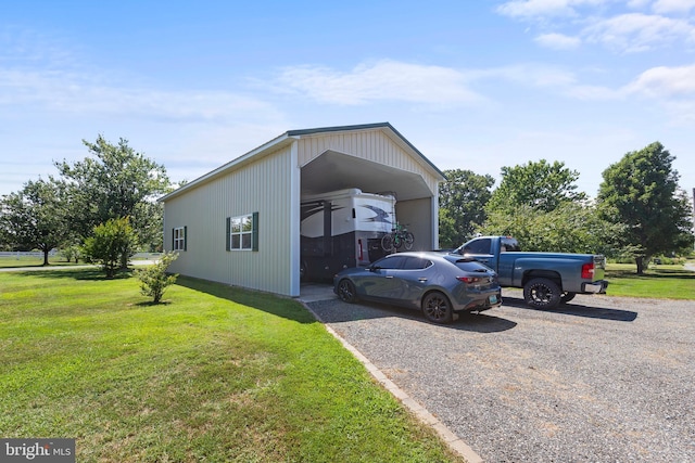 view of front of house with a front lawn and a carport