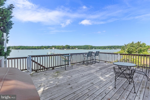 wooden terrace with a water view