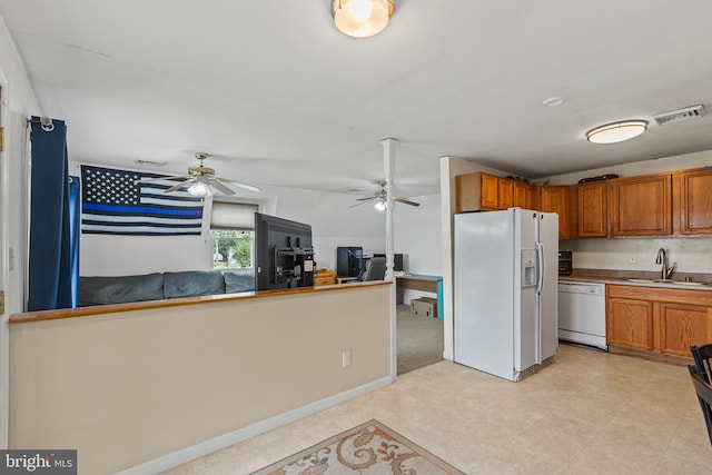 kitchen featuring ceiling fan, sink, white appliances, and light tile floors