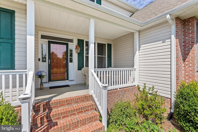 entrance to property featuring a porch