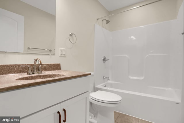 full bathroom with toilet, washtub / shower combination, vanity, and tile patterned floors