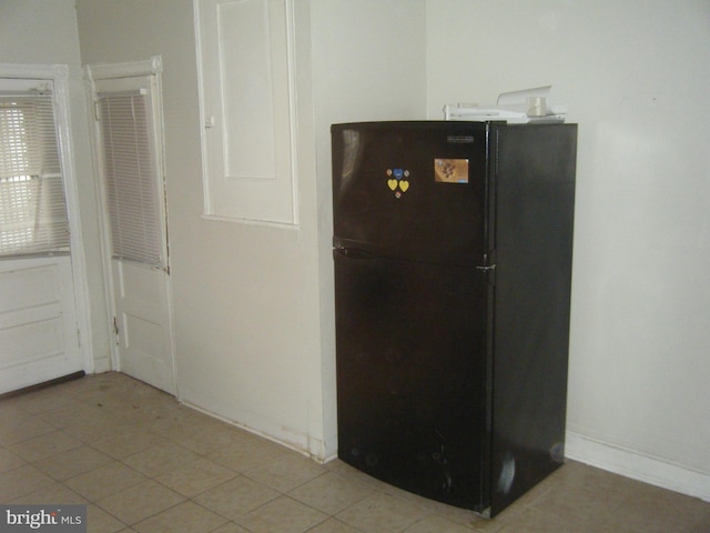 room details featuring black refrigerator