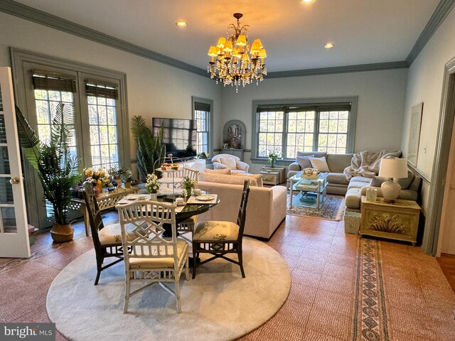 dining area featuring a chandelier and ornamental molding