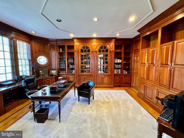 office area featuring light hardwood / wood-style floors and built in desk