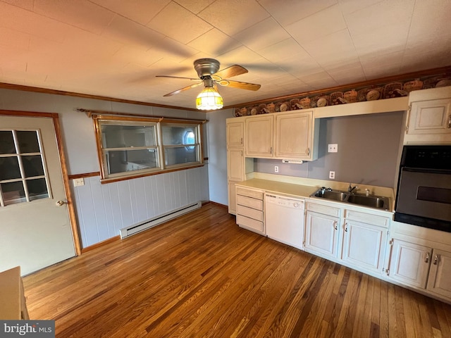 kitchen with ceiling fan, a baseboard radiator, dishwasher, dark hardwood / wood-style flooring, and oven