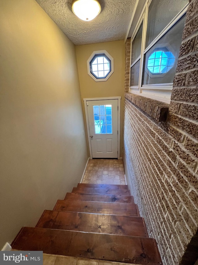 interior space with a textured ceiling