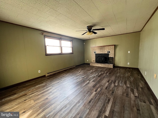 unfurnished living room with ceiling fan, a baseboard radiator, dark wood-type flooring, and a fireplace