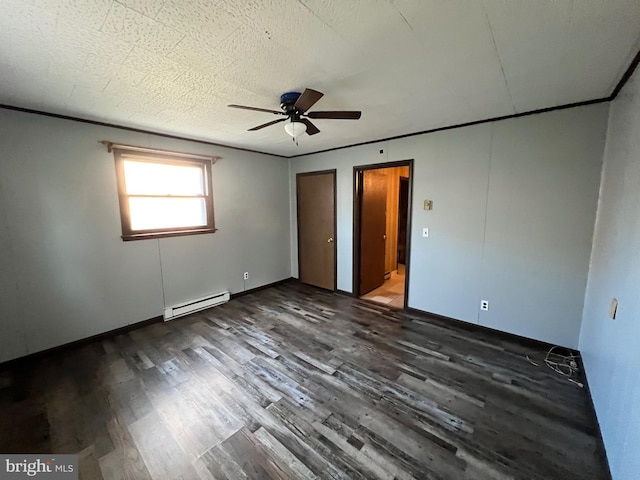 interior space featuring ceiling fan, dark hardwood / wood-style floors, and a baseboard heating unit