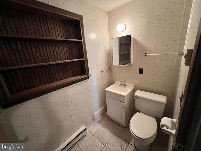 bathroom with tile flooring, toilet, and vanity