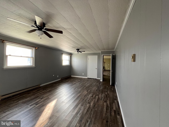 unfurnished room featuring ceiling fan, a baseboard radiator, dark wood-type flooring, and ornamental molding