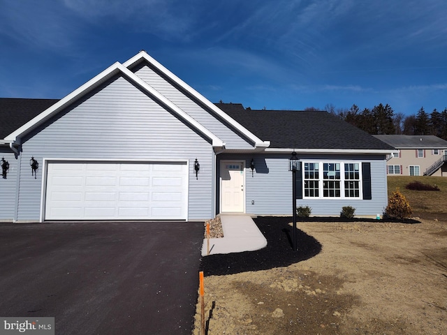 ranch-style home with a garage