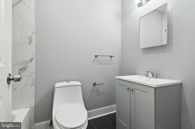 bathroom with tile floors, toilet, and vanity