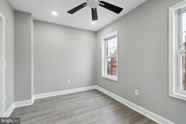 unfurnished room featuring light hardwood / wood-style floors and ceiling fan