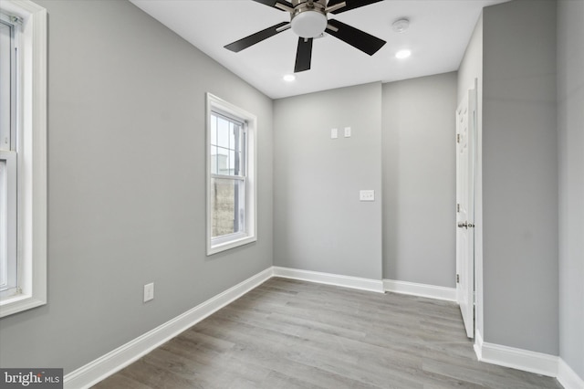 empty room with light hardwood / wood-style floors and ceiling fan