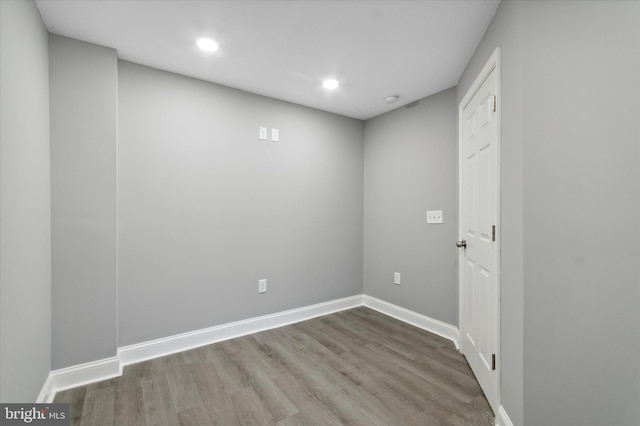 empty room featuring dark hardwood / wood-style flooring