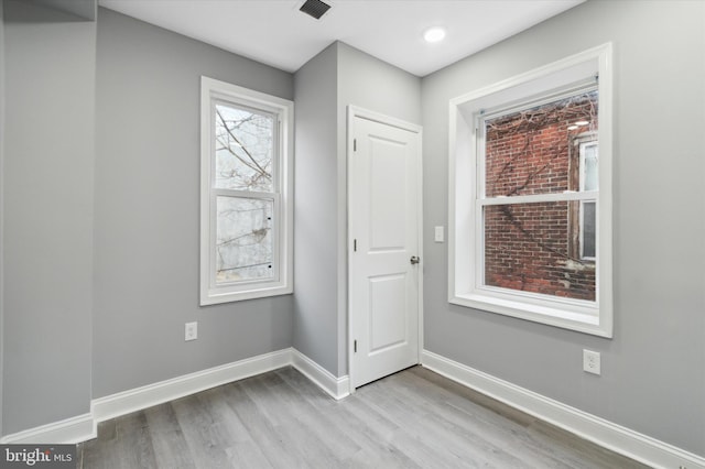 spare room with light wood-type flooring