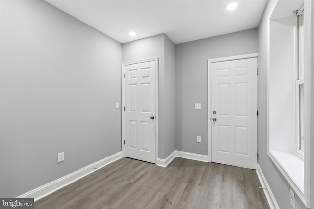 foyer entrance with hardwood / wood-style flooring