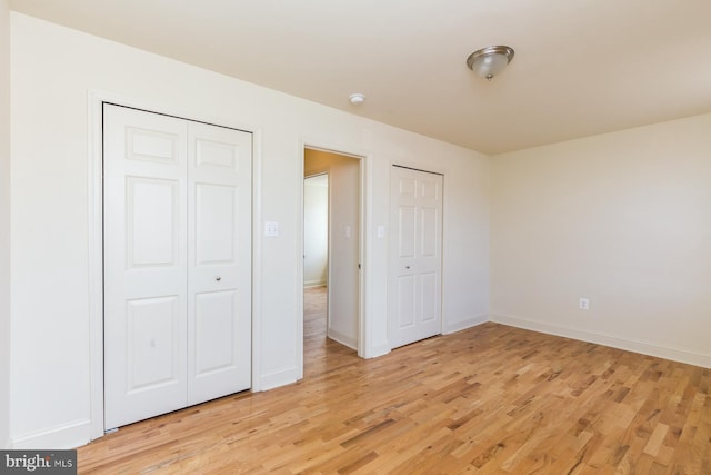 unfurnished bedroom with light hardwood / wood-style flooring