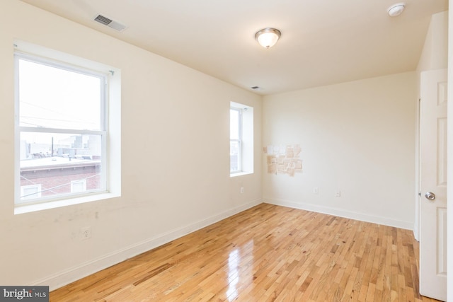 unfurnished room featuring light hardwood / wood-style flooring