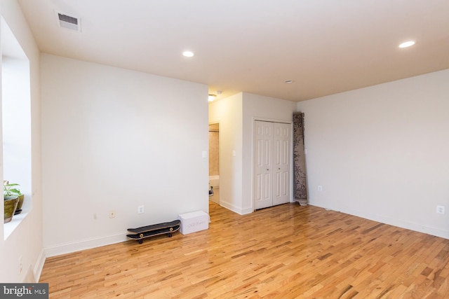 spare room featuring light hardwood / wood-style flooring