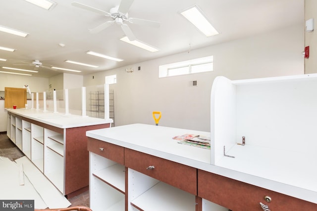 kitchen with a kitchen island and ceiling fan