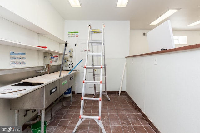 kitchen with dark tile floors