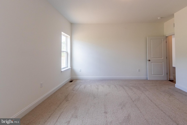 empty room featuring carpet flooring