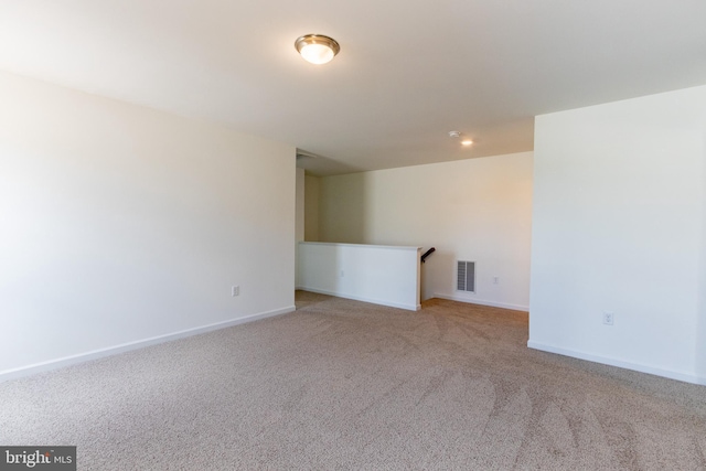 empty room with light colored carpet