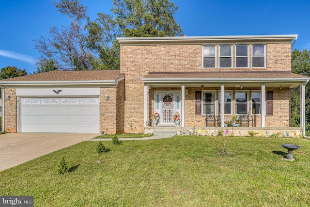 view of property featuring a front lawn, covered porch, and a garage