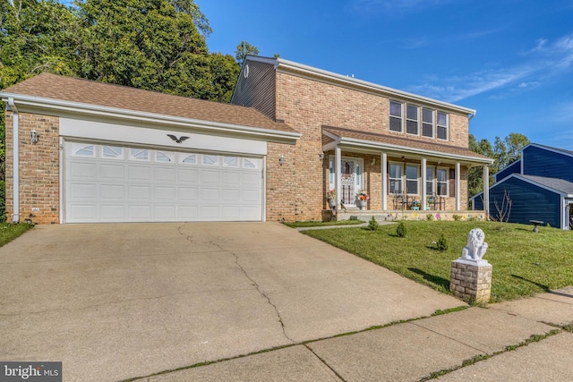 view of front of house featuring covered porch, a front lawn, and a garage