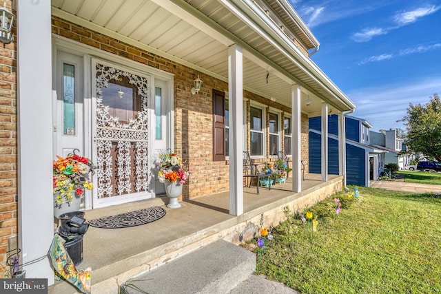 entrance to property featuring a porch