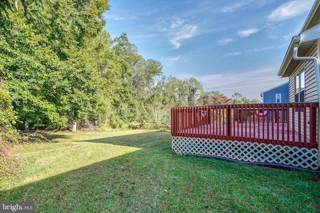 view of yard with a wooden deck