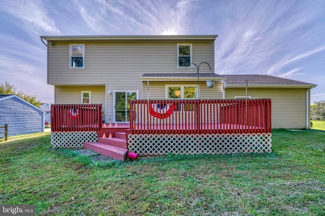 back of property featuring a wooden deck and a yard