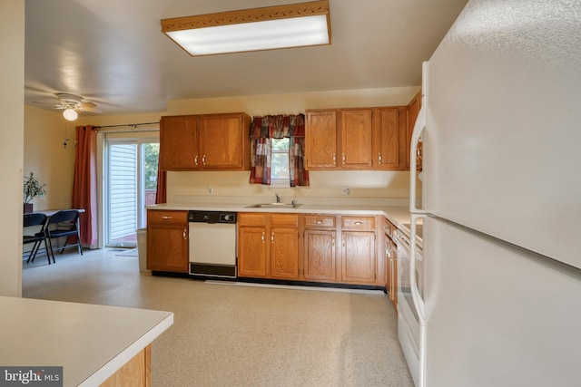 kitchen featuring ceiling fan, white appliances, and sink