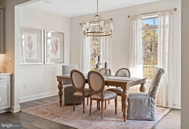 dining room featuring a notable chandelier and hardwood / wood-style floors