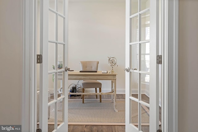 home office featuring french doors and dark wood-type flooring