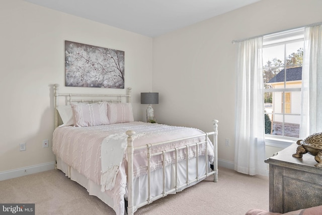 bedroom with light colored carpet